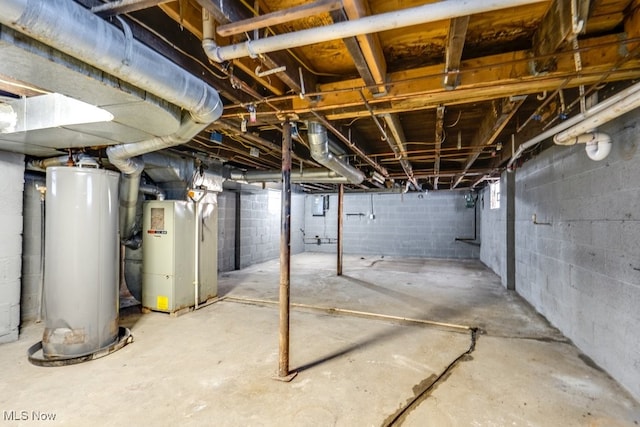 basement featuring gas water heater and heating unit