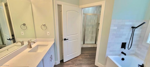 bathroom with hardwood / wood-style flooring and vanity