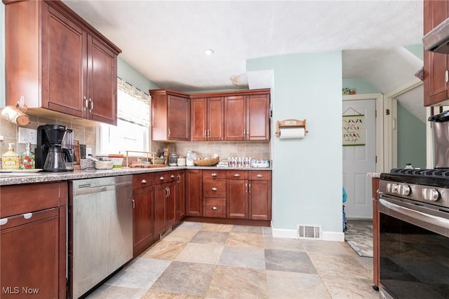 kitchen featuring decorative backsplash and stainless steel appliances