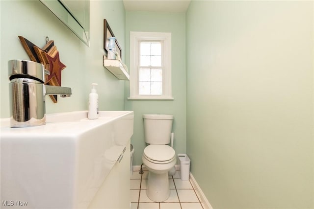 bathroom with tile patterned flooring and toilet