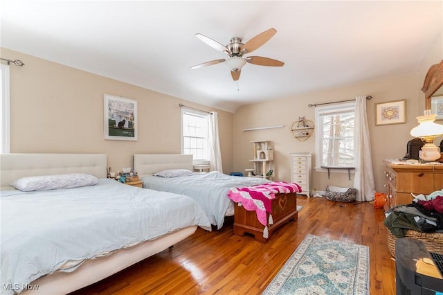 bedroom with ceiling fan and wood-type flooring