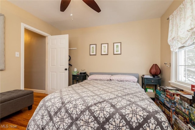 bedroom featuring hardwood / wood-style flooring and ceiling fan