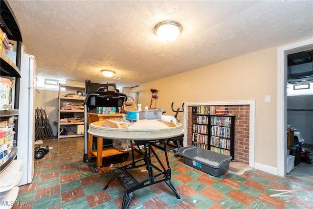 dining room with a textured ceiling