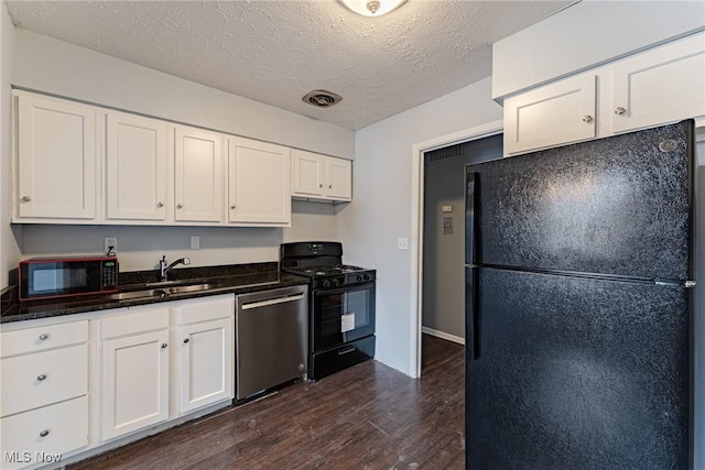 kitchen featuring white cabinetry, sink, dark wood-type flooring, a textured ceiling, and black appliances