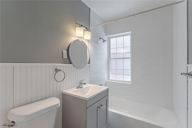 full bathroom featuring vanity, toilet, and tiled shower / bath