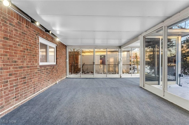 unfurnished sunroom featuring a healthy amount of sunlight