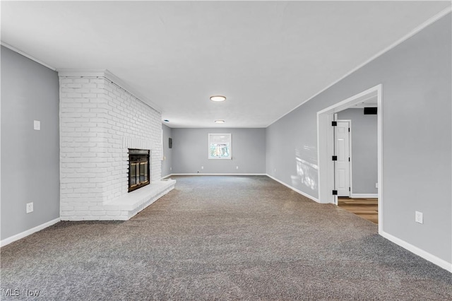 unfurnished living room featuring a fireplace and carpet flooring