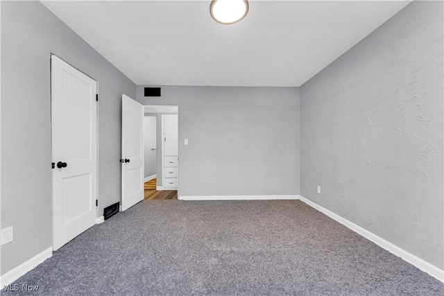 unfurnished bedroom featuring carpet