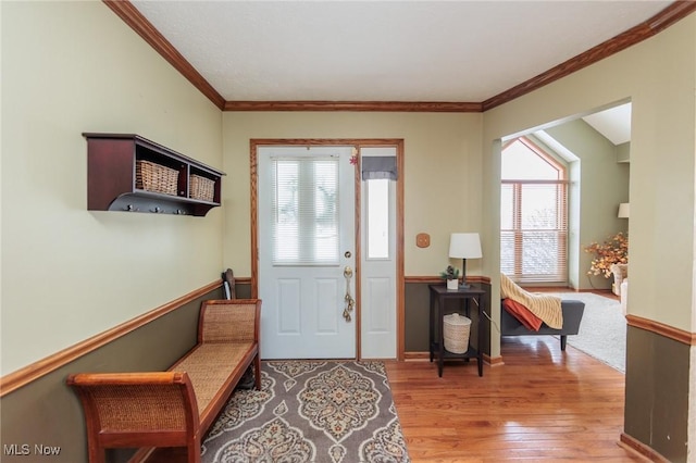 entryway with crown molding, light hardwood / wood-style flooring, and plenty of natural light