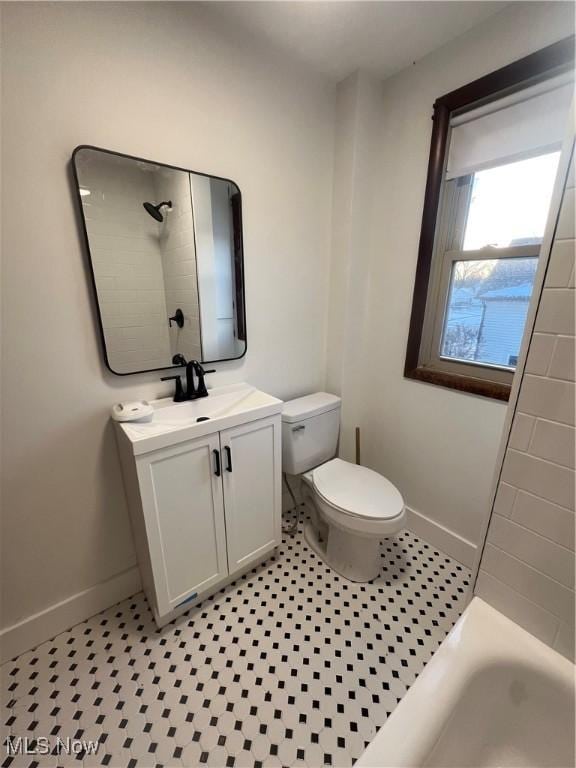 full bathroom featuring tile patterned flooring, vanity, toilet, and tub / shower combination