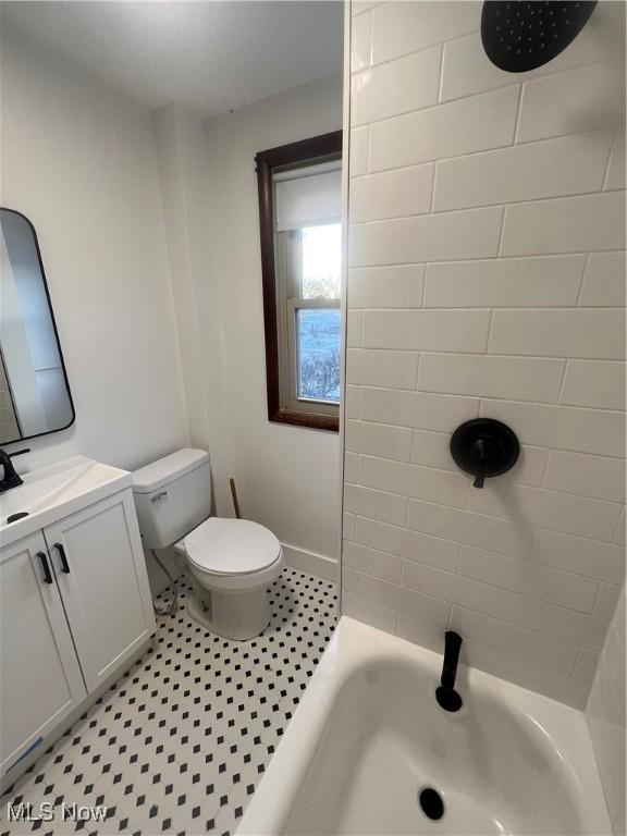 full bathroom with tile patterned floors, vanity, toilet, and tiled shower / bath