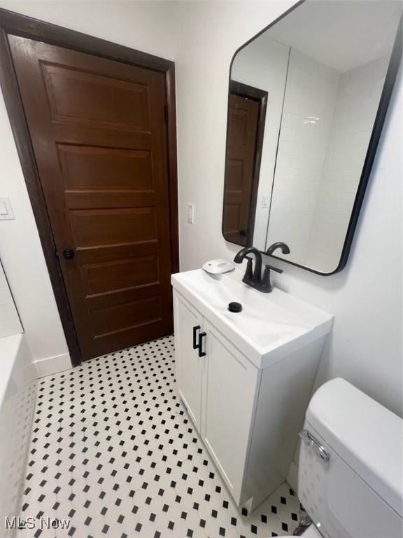 full bathroom with separate shower and tub, vanity, and toilet