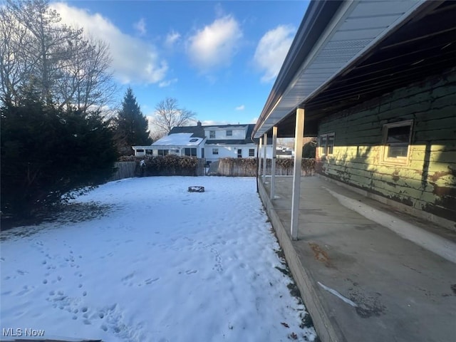 view of yard layered in snow