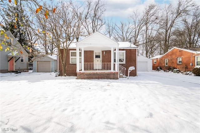 bungalow-style home featuring an outbuilding and a garage