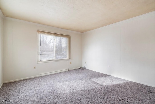 carpeted spare room with crown molding