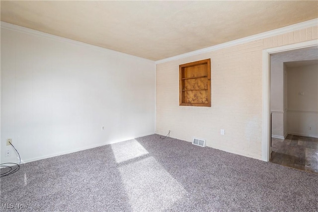 carpeted spare room with crown molding