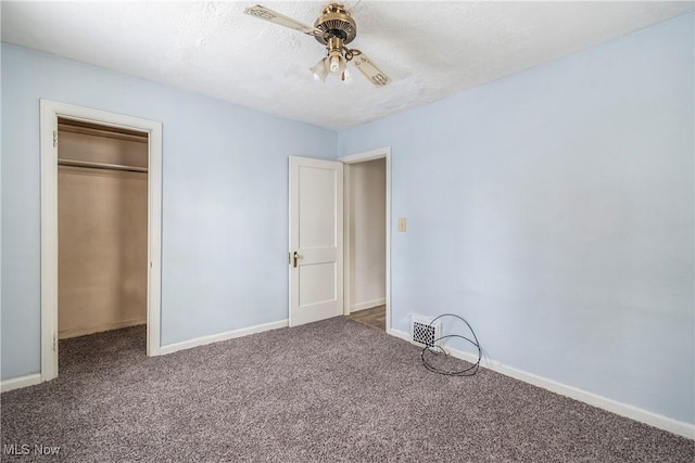 unfurnished bedroom featuring carpet flooring, a closet, and ceiling fan