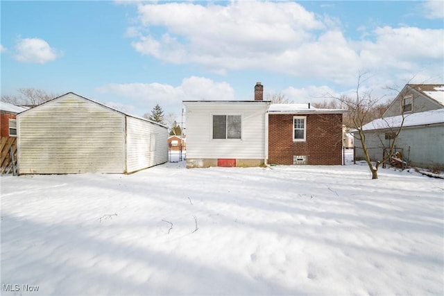 view of snow covered house