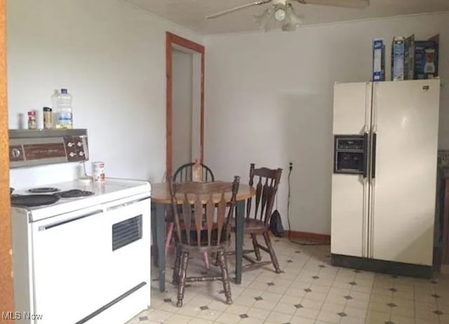 kitchen featuring electric range oven, white refrigerator with ice dispenser, and ceiling fan