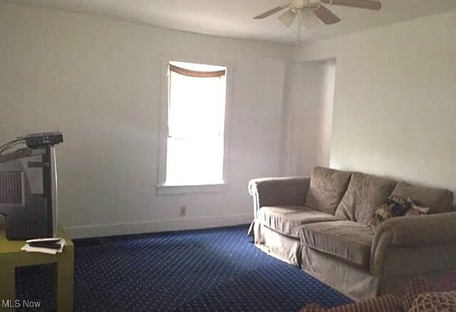 living room featuring ceiling fan