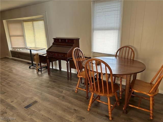 dining area featuring hardwood / wood-style floors and plenty of natural light