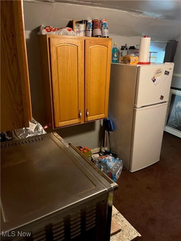 kitchen featuring white fridge