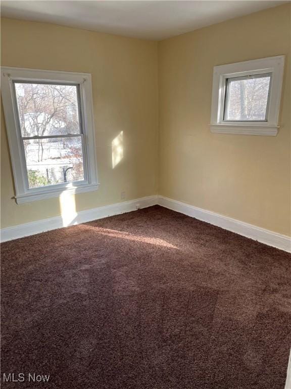 empty room with carpet flooring