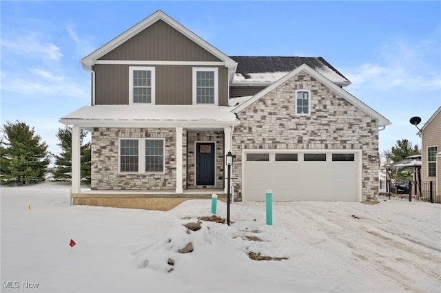 view of front property with covered porch and a garage