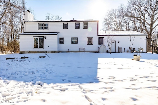 view of snow covered house