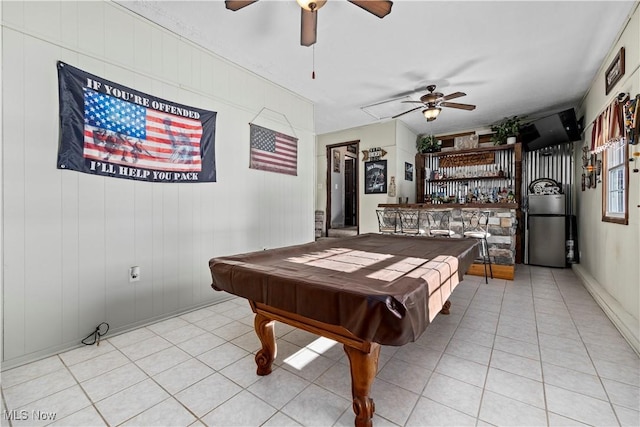 recreation room with pool table, ceiling fan, light tile patterned floors, and bar