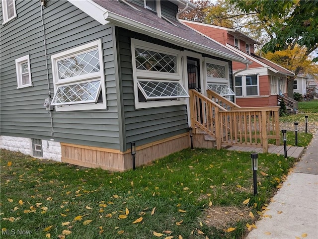 view of property exterior featuring a yard