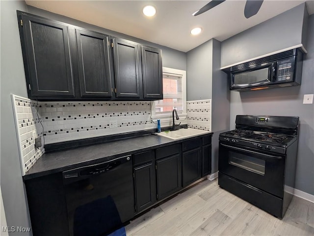 kitchen with black appliances, sink, light hardwood / wood-style flooring, decorative backsplash, and ceiling fan