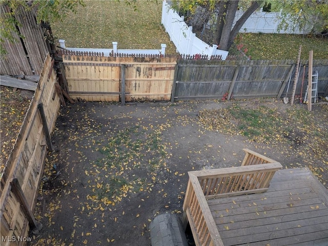 view of yard with a wooden deck