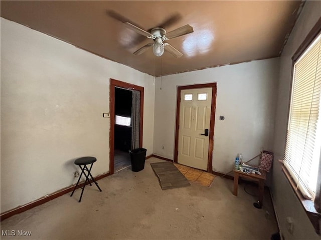 entryway featuring ceiling fan