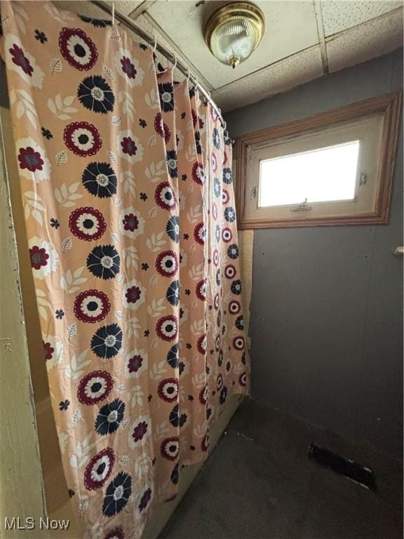 bathroom featuring a paneled ceiling