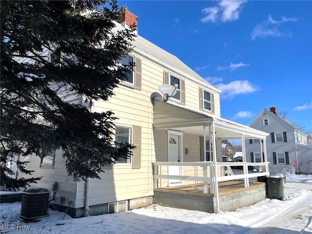 view of front of home featuring a porch and central air condition unit