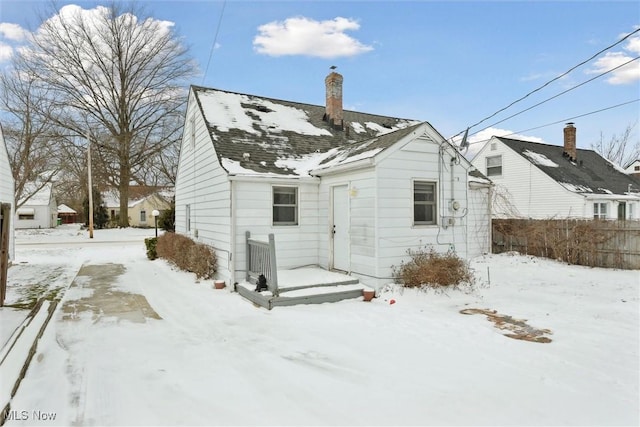 view of snow covered house