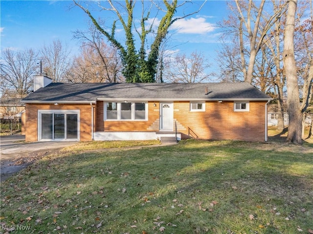 back of house featuring a yard