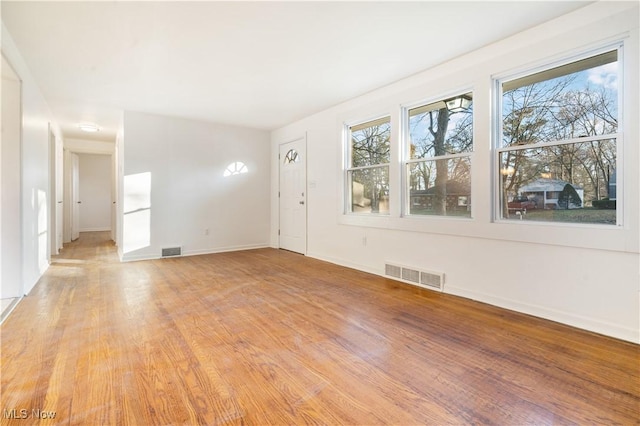 empty room with light wood-type flooring