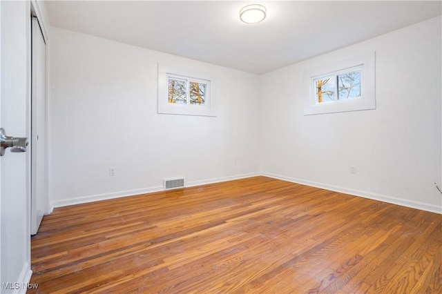 empty room featuring hardwood / wood-style floors