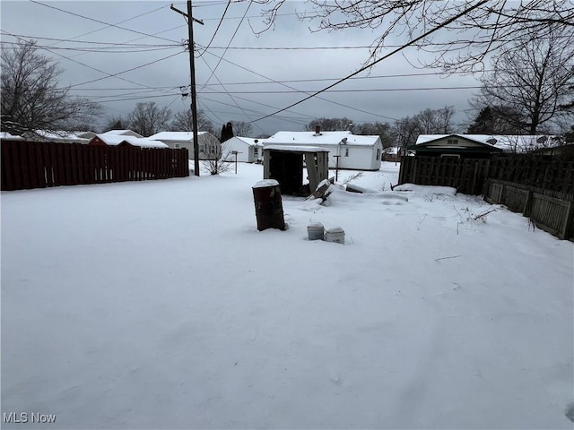 view of yard covered in snow