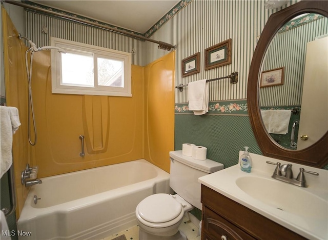 full bathroom with vanity,  shower combination, and toilet