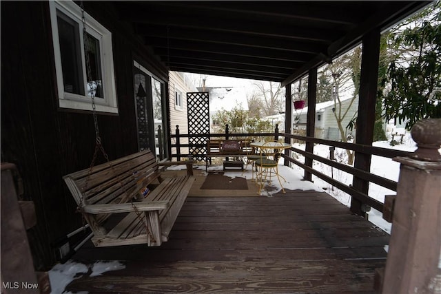 view of snow covered deck