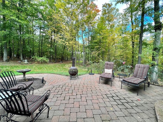 view of patio / terrace with a fire pit