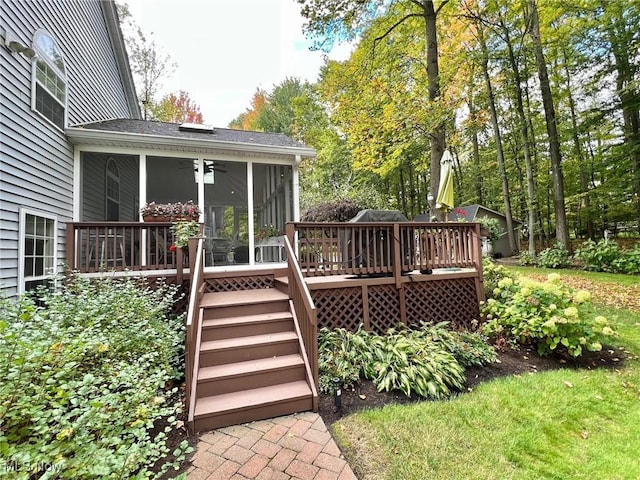 deck with a sunroom and ceiling fan