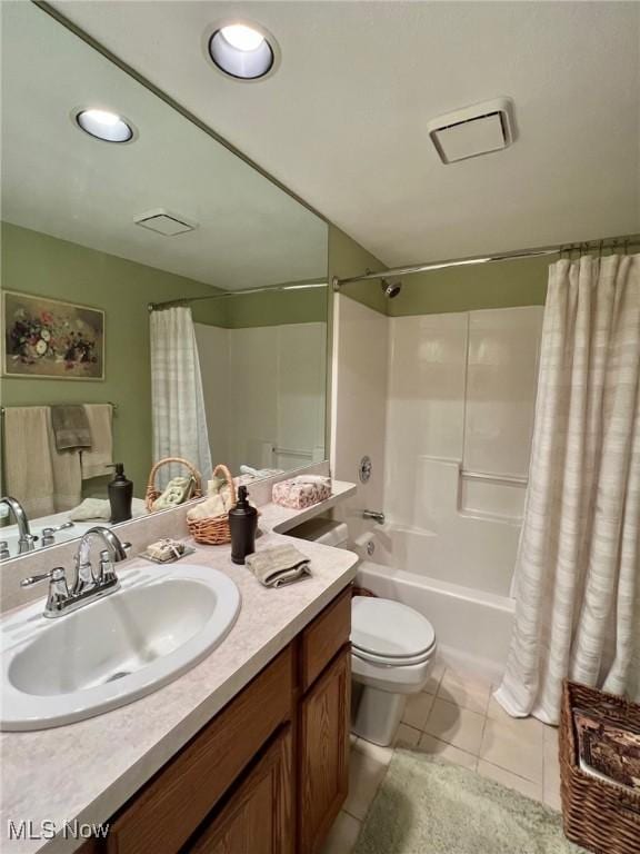 full bathroom with toilet, shower / bath combo, vanity, and tile patterned floors