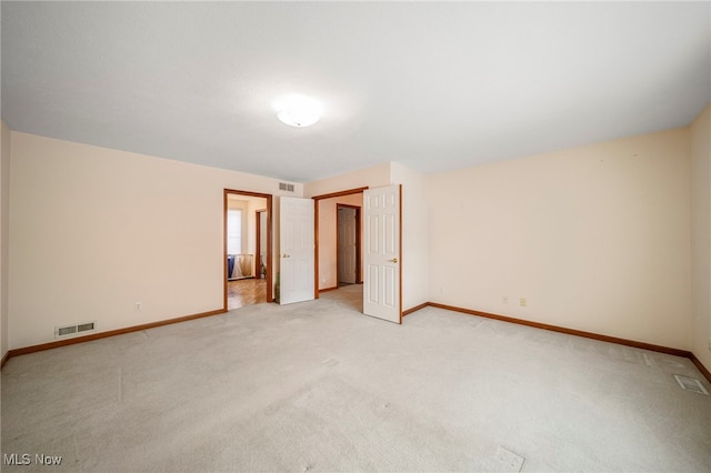 unfurnished bedroom with light carpet