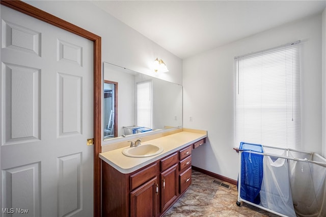 11579 Olde Stone Ct, Concord, OH 44077 - bathroom with vanity, baseboards, and healthy amount of natural light
