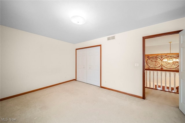 11579 Olde Stone Ct, Concord, OH 44077 - unfurnished room featuring light carpet, a chandelier, and baseboards