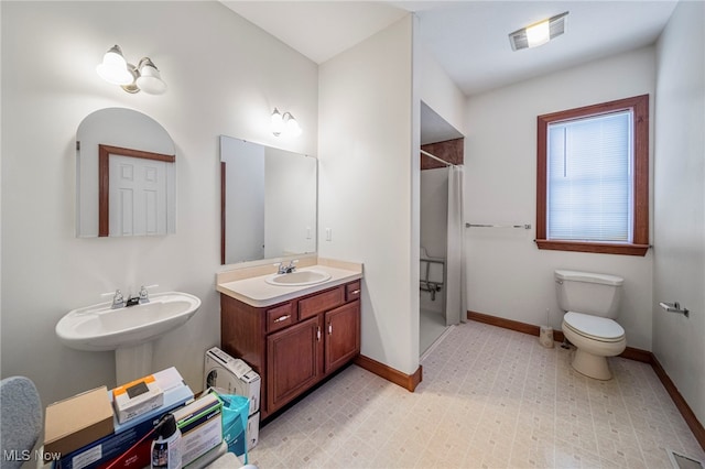 11579 Olde Stone Ct, Concord, OH 44077 - bathroom featuring baseboards, a shower with curtain, toilet, and a sink